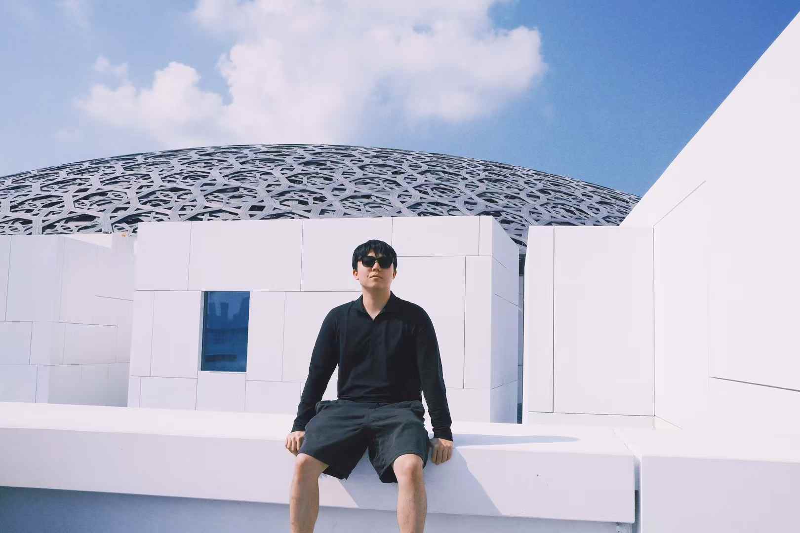 Cheng Yin traveling under a blue sky